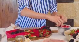 In the clip, Meghan introduced her board as 'easy entertaining,' and decorated a wooden board with various fruits, cheeses, and crackers, as well as her sold-out, $14 As Ever raspberry spread