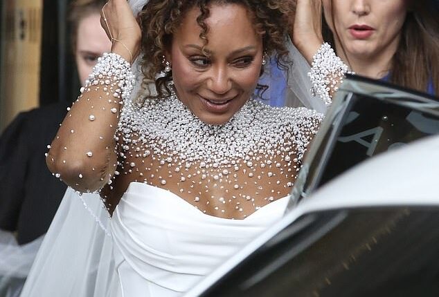 Mel B looked every inch the blushing bride in a pearl-adorned white gown as she arrived to marry fiance Rory McPhee at St Paul's cathedral on Saturday
