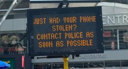 The electronic sign outside Stratford shopping centre now tells the public to 'contact police', not 'call 999'