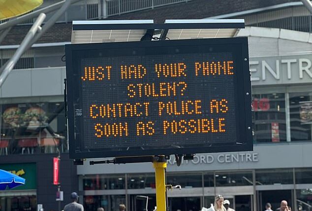 The electronic sign outside Stratford shopping centre now tells the public to 'contact police', not 'call 999'