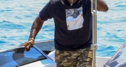 Jordan was seen on the coast of Mykonos walking onto a dock while puffing on a cigar