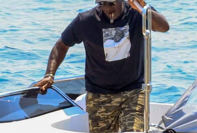 Jordan was seen on the coast of Mykonos walking onto a dock while puffing on a cigar