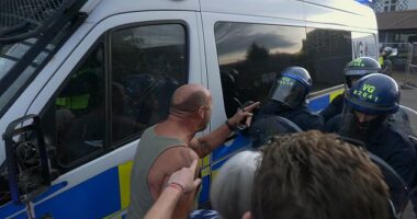 Riot police smashed a shield into a protester's face and knocked his teeth out in a heated clash outside an Epping migrant hotel