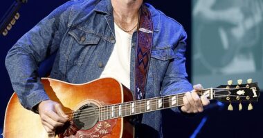 Morgan Wallen took a cheeky dig at audience members with 'side chicks' during his latest show in Arizona on Friday; pictured onstage in Nashville last month