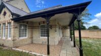 The stylish home where a pensioner was brutally murdered and dismembered by her lodger has been put up for sale, MailOnline can reveal