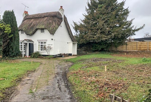 Villagers have been left baffled by the identity of a local homeowner who employed a 'rough' gang of workers to demolish a beloved 300-year-old cottage