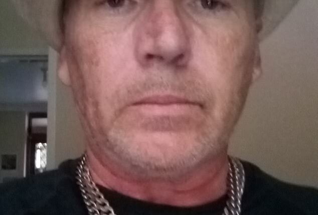 Andrew Cambouris (pictured) terrorised his neighbours with a fake gun and anti-Semitic rants for several weeks