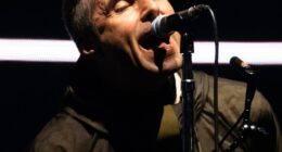 An Oasis fan went viral after she was spotted having to use app Shazam to identify 'one of the greatest songs of all time' during the band's opening gig in Cardiff on Friday