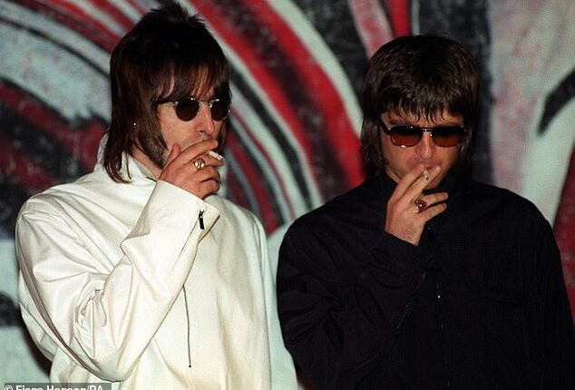 Now Oasis has gone woke, with the band's tell-all documentary is slapped with trigger warnings over 'smoking and drinking' (Liam and Noel Gallagher pictured in 1999)