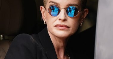 Kelly Osbourne wore Ozzy's trademark purple glasses in a heartbreaking nod to her beloved father at his funeral procession in Birmingham on Wednesday