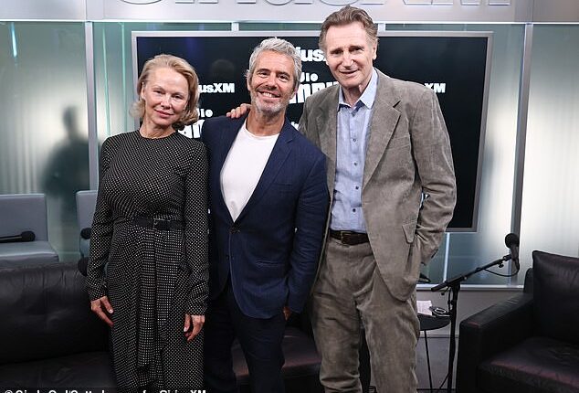 Pamela Anderson (L) and her Naked Gun leading man Liam Neeson (R) brought their undeniable chemistry to SiriusXM Studios in Manhattan on Wednesday where host Andy Cohen (M) shared rare insight into their budding romance