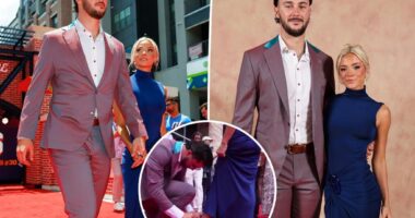 Paul Skenes helps Livvy Dunne with her high heels on MLB All-Star game red carpet