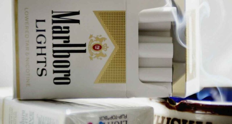 Philip Morris says black-market cigarettes are a big deal, as sales miss and stock falls