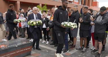 Portuguese-born Everton stars Youssef Chermiti (left) and Beto (right) laid wreaths at Anfield on behalf of the club and paid their respects to Diogo Jota
