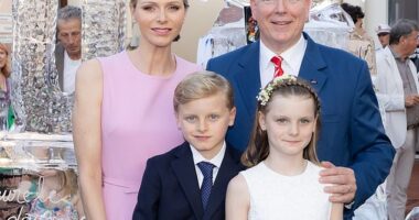 The Prince and Princess of Monaco were spotted beaming alongside their two children during a glorious ceremony to mark the monarch's 20-year reign