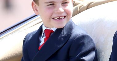 Prince Louis, the spirited third child of the Prince and Princess of Wales, is pictured flashing a grin during Trooping the Colour on June 14