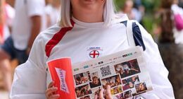 A fan smiles as she awaits the much-anticipated Women's Euro Final in Switzerland