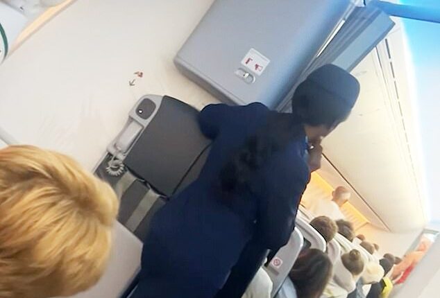 This is the terrifying moment passengers onboard a flight were left fearing for their lives after a fellow traveller attempted to open the cabin doors while at 30,000 feet