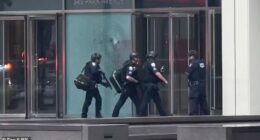Officers in protective gear were seen entering a building in midtown Manhattan on Monday following reports of an active shooter