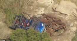 The ATV appears to have come to a stop on top of another vehicle. Hutchins' blue Polaris ATV is seen lying on top of a rusty vehicle, which also appeared to have gone over the cliff