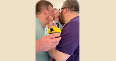 gay pedo couple kissing baby