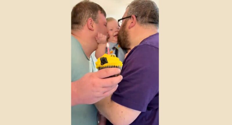 gay pedo couple kissing baby