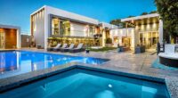 The American Idol executive and her husband, found murdered inside their $5 million California mansion (pictured), struggled with the intruder after discovering him inside their home - just moments before they were fatally shot in the head, police revealed