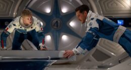 (L-R) Joseph Quinn as Johnny Storm/Human Torch and Pedro Pascal as Reed Richards/Mister Fantasticin 20th Century Studios/Marvel Studios' THE FANTASTIC FOUR: FIRST STEPS. Photo courtesy of 20th Century Studios/Marvel Studios. © 2025 20th Century Studios / © and ™ 2025 MARVEL.