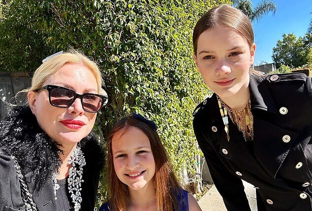 Alice Evans has rejected the claim by her ex-husband Ioan Gruffudd that she asked her children to write unflattering text messages about him [pictured with daughters Ella, 15 (R) and Elsie, 11 (C)]