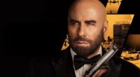 The poster for Travolta's latest film High Rollers, in which he plays Mason Goddard, a master thief who must pull off a dangerous casino heist when his nemesis kidnaps his lover