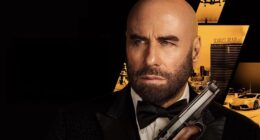 The poster for Travolta's latest film High Rollers, in which he plays Mason Goddard, a master thief who must pull off a dangerous casino heist when his nemesis kidnaps his lover