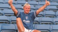 Paul Gascoigne poses in a Rangers shirt after signing from Lazio in July 1995