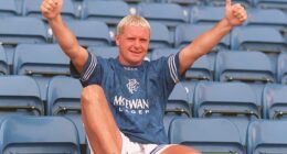 Paul Gascoigne poses in a Rangers shirt after signing from Lazio in July 1995
