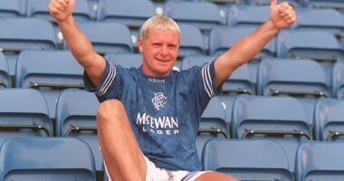 Paul Gascoigne poses in a Rangers shirt after signing from Lazio in July 1995