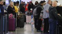 An impending tropical storm in the Gulf has set off a chain reaction of ground stops and lengthy delays at major airports along the entire East Coast Monday