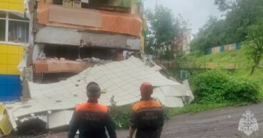 Rescuers inspect a kindergarten damaged by an earthquake in Petropavlovsk-Kamchatsky, Russia, Wednesday, July 30, 2025.