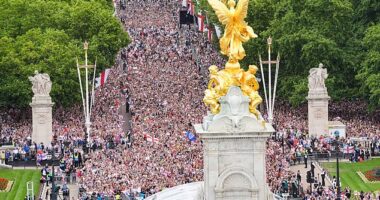 The decibel levels were already pretty high - but when the open-top bus finally crawled along The Mall, the 65,000-strong crowd went completely bananas