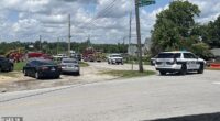 A state trooper has been seriously wounded in a shootout at a major airport before the gunman fled into a church (street outside pictured) during Sunday service