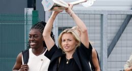 England's Leah Williamson holds the Euro 2025 trophy as she heads to greet fans