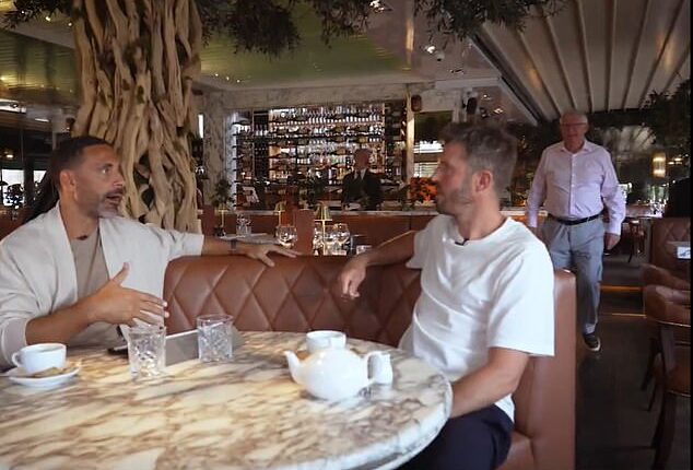 Sir Alex Ferguson was seen in the background as Rio Ferdinand spoke to Michael Carrick