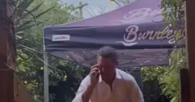 Wayne Carey is pictured in a grab from a viral video that was taken in a trendy Melbourne bar recently. He has furiously blasted claims it shows him and a woman emerging from the bathroom after having a sexual encounter in the toilets