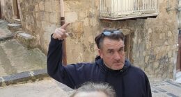 Derbyshire couple Sally Boole, 54, and her husband Martin, 56, outside the house in Mussomeli, Sicily, that they bought for only 1 euro