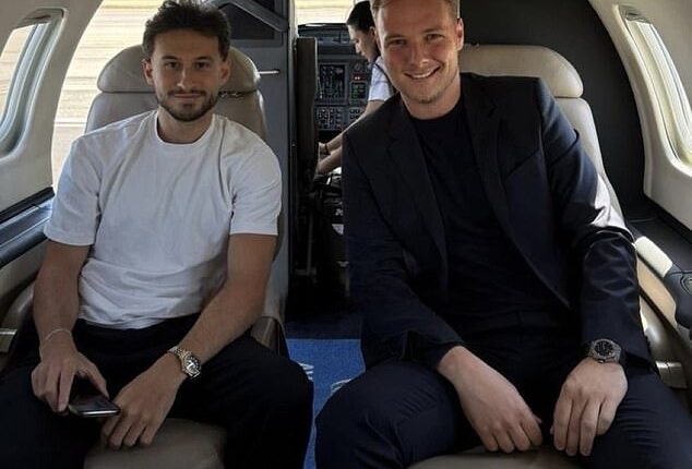 Celtic winger Nicolas Kuhn (left) and agent Fabian Dingler on a private jet heading to Italy