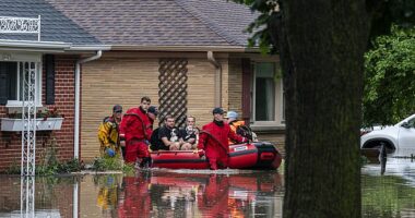 Damaging flash flooding on Saturday left Midwesterners stranded in their homes. First responders are pictured here rescuing residents from their homes in Wauwatosa, Wisconsin