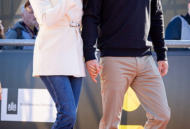 Prince Harry (pictured with Meghan Markle in April 2022) has denied having a 'physical fight' with Prince Andrew after reports punches were thrown when the disgraced Duke of York reportedly said something behind his back