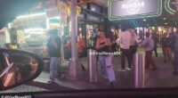 People are seen fleeing from the scene of a shooting in Times Square that injured three people in the early hours of Saturday morning