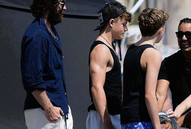 Elton John and David Furnish's rarely-seen sons  Zachary, 14, and Elijah, 12 were seen departing Elton's £23 million yacht on Sunday with family friend Aaron Taylor Johnson