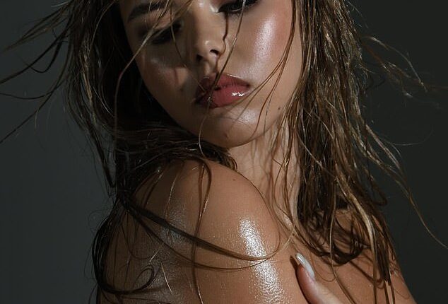 Amanda Holden 's lookalike daughter Lexi Hughes sizzled in a sultry topless snap as she posed up a storm in a sizzling new photoshoot