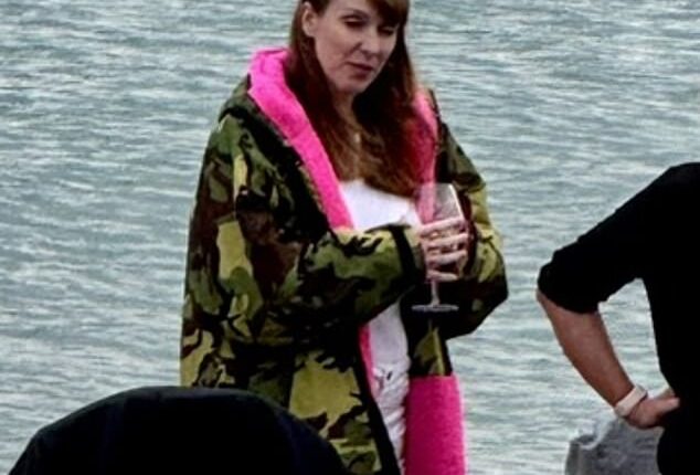 Angela Rayner, pictured here drinking wine on Hove beach, dodged having to shell out an extra £40,000 on stamp duty on her new flat in East Sussex, it has been claimed