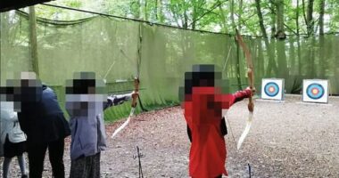 Picture advertising the camp shows children taking part in archery as one of the activities